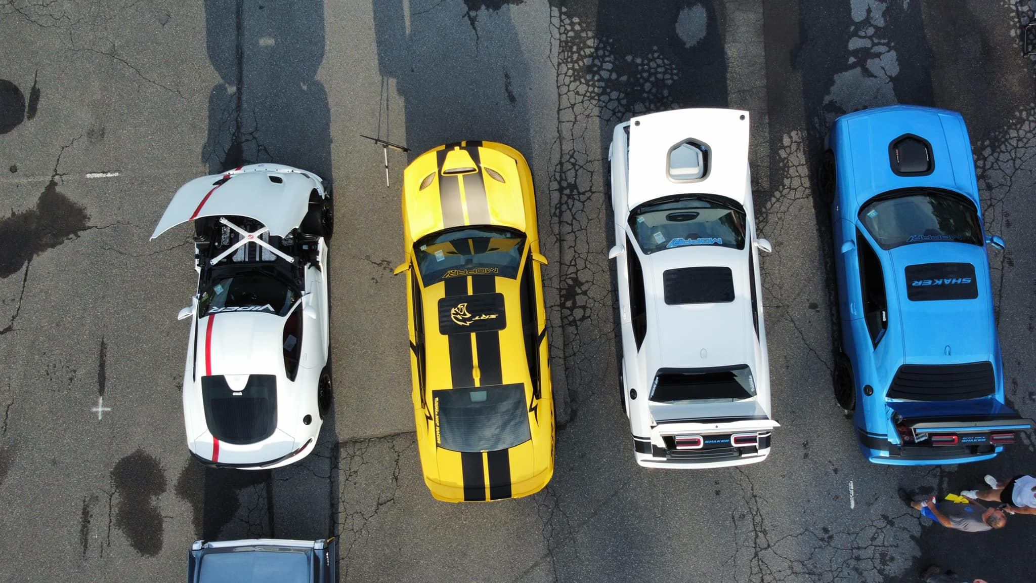 Overhead view of four show cars lined up together